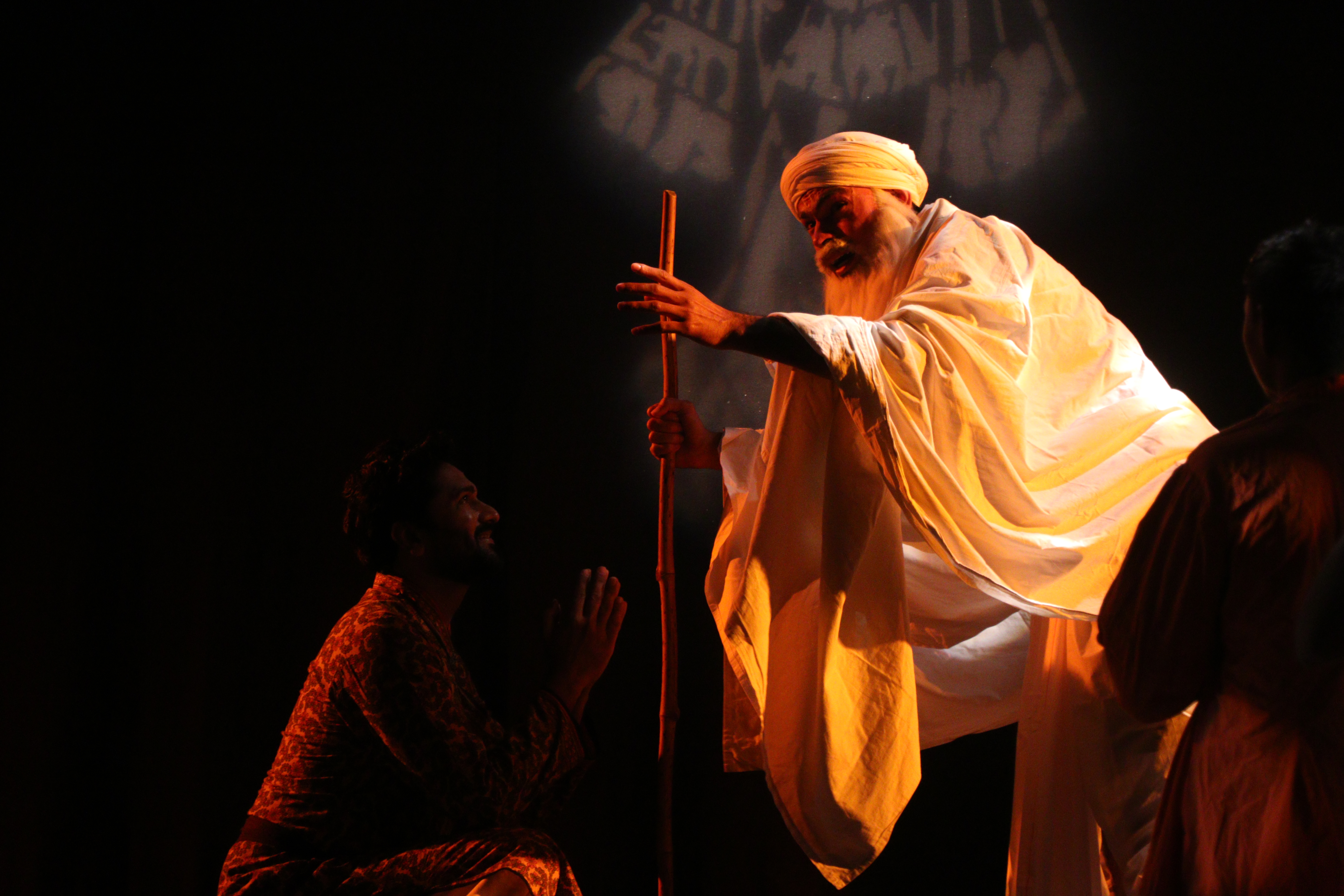 Spiritual theatre performance with traditional musicians